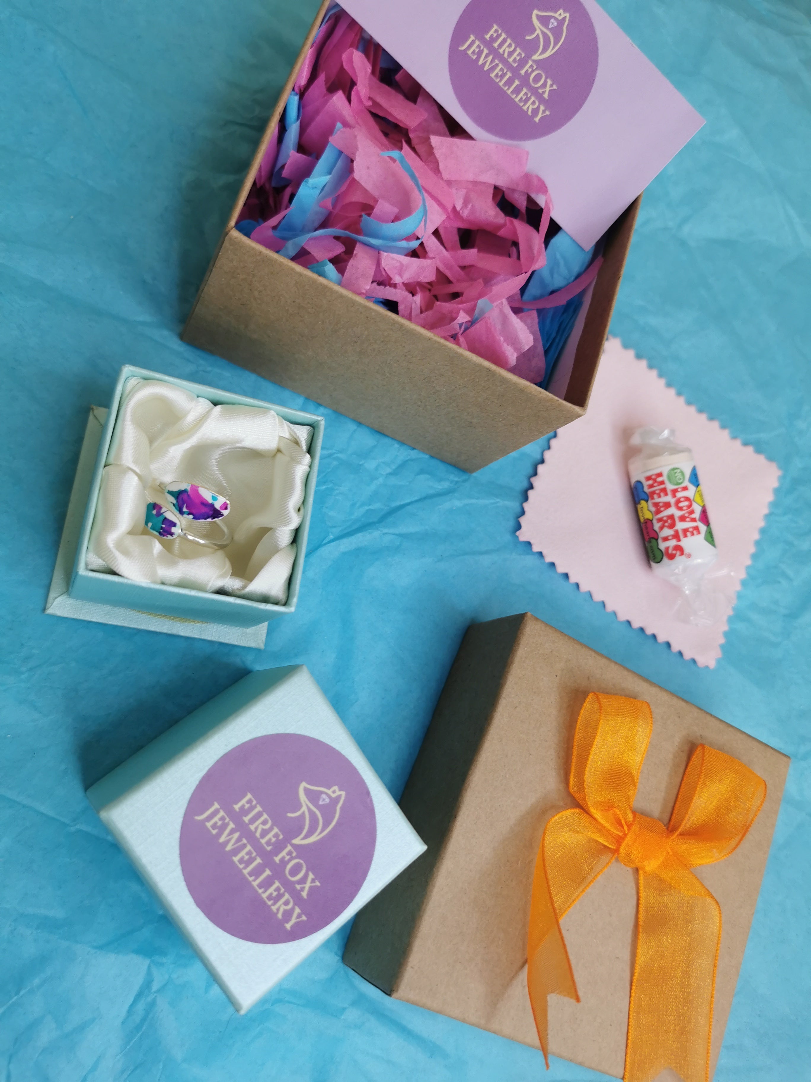 Jewellery box with polishing cloth, sweets and care instructions 