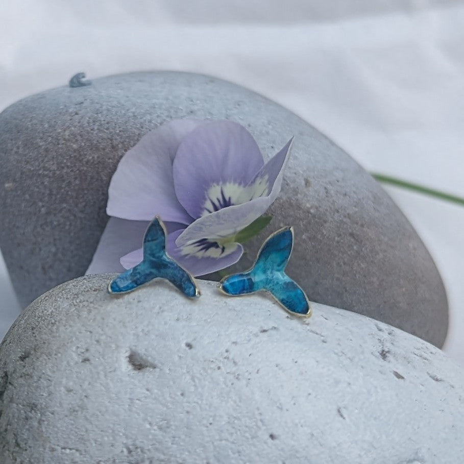 'Theia's Garden' Blue Star Stud Earrings. Earrings displayed on rocks 