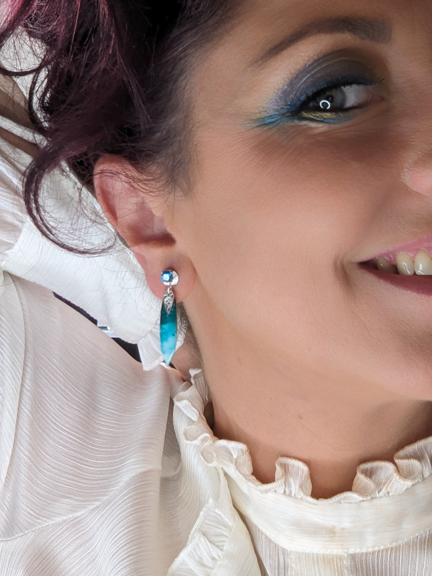Model wearing Ocean Blue Earrings with Blue Cubic Zirconia 